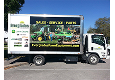 Full truck wrap designed by Custom Graphics and Signs