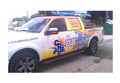 Pickup truck wrap designed by Custom Graphics and Signs