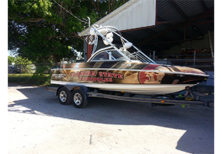 Ski boat wrap designed by Custom Graphics and Signs