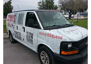 Van wrap front view by Custom Graphics and Signs