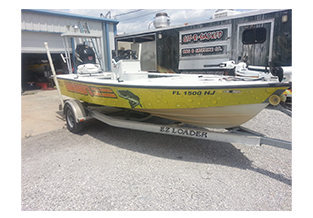 Boat wrap designed by Custom Graphics and Signs