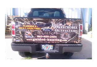 Tailgate view of truck wrap designed by Custom Graphics and Signs