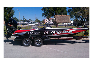 Race boat wrap designed by Custom Graphics and Signs