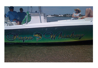 Boat wrap designed by Custom Graphics and Signs